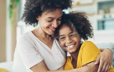 Mom and daughter hugging and mom encouraging self-control in tween 
