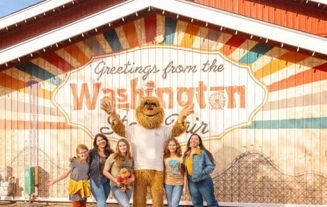 Family posing outside the Washington State Fair in Puyallup