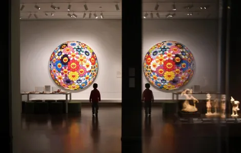 young boy walks in the Seattle Asian Art Museum, a local museum you can visit for free or at a discounted rate