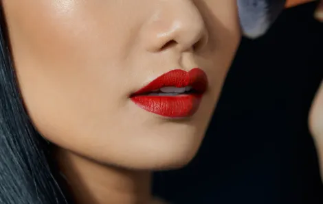 Asian woman wearing matte red lipstick