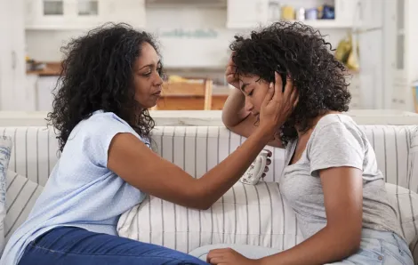 Mom helping daughter with emotional distress