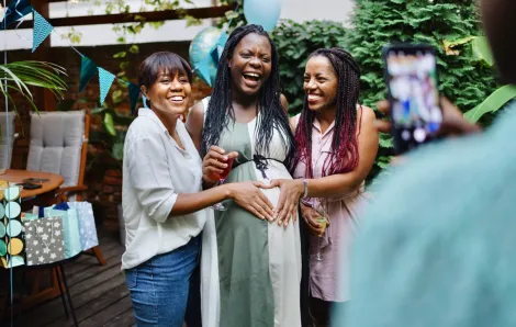 women smiling and having fun at a baby shower