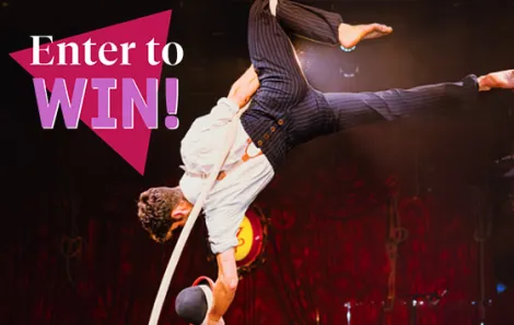 "Enter to Win" text over circus performer 