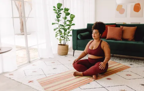 women meditating at home peacefully