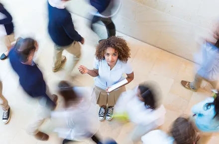 woman in the middle of other students rethinking college and college alternatives