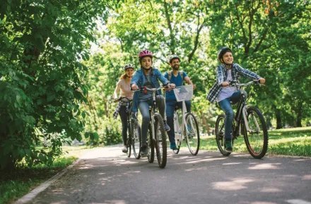 Family riding a bike on the Burke-Gilman trail 