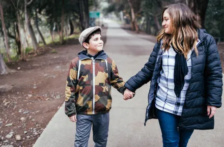 Mom and son walking and having a mental health check in
