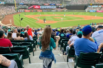 Girl walking down steps at T-Mobile Park to watch a Seattle Mariners Game