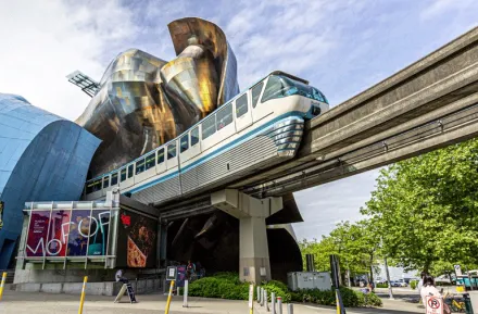 The Seattle Monorail on its track outside of MoPOP at Seattle Center, one of the best train adventures for families