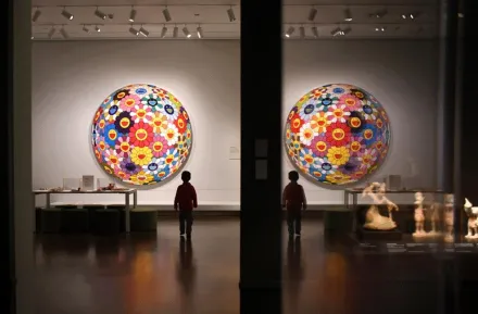 young boy walks in the Seattle Asian Art Museum, a local museum you can visit for free or at a discounted rate