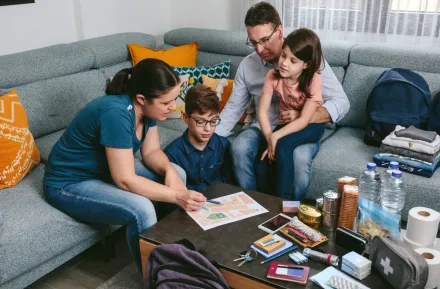 Family making a fire drill emergency plan together