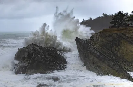 Huge waves smash into a rock during a storm on the Oregon coast