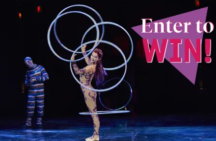 "Enter to Win" text over acrobatic performer