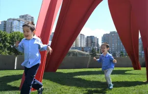 little boys running through the sculpture park by the Seattle Waterfront