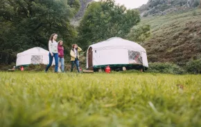 family camping in a yurt