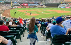 Girl walking down steps at T-Mobile Park to watch a Seattle Mariners Game