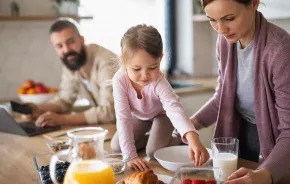 Family sharing a dairy-rich breakfast together on a busy morning