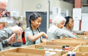 Girl organizing food donations during the holidays