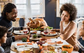 Family eating Thanksgiving dinner from a Seattle-area restaurant serving Thanksgiving dinner and takeout