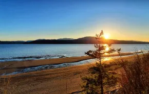 Sunset from Chevy Chase Beach Cabins, a cabin rental near Seattle for families, and one of many fall things to do 