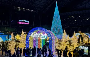 Enchant Christmas light maze entrance with Santa's Magic Timepiece theme, a holiday event in Seattle for families