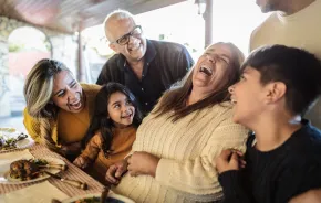 A family laughing and enjoying time together on Thanksgiving 