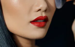 Asian woman wearing matte red lipstick