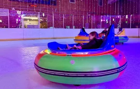 A kid spins in an ice bumper car at Sprinker Rec Center in Tacoma during ice lights