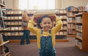 little girl having fun at the library 