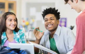 Students in a classroom working and engaging together with no cell phones