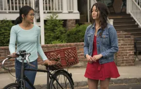 two girls walking on the sidewalk, a still image from the movie "The Half of It"