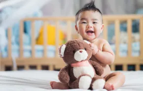 cute baby holding a teddy bear