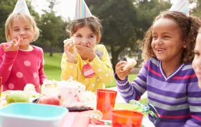 group of kids having an outdoor birthday party