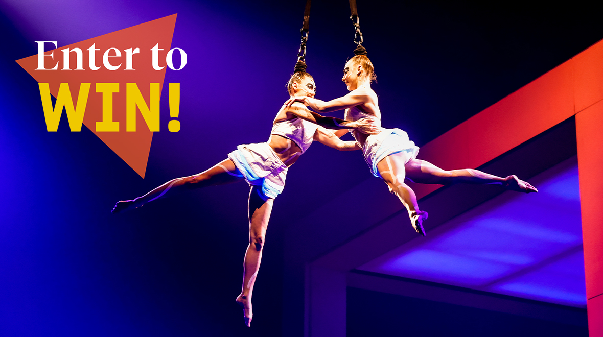 "Enter to Win!" text over acrobatic performers